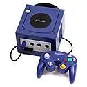 Purple video game console with attached controller