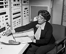 Mary Jackson sitting, adjusting a control on an instrument